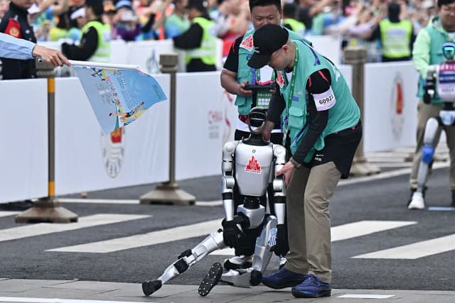 China’s First Robot Marathon Runners Trip, Emit Smoke, Fall Apart